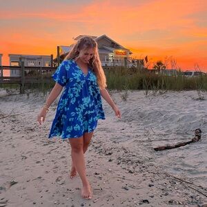 Mini royal blue dress with light blue floral detail.